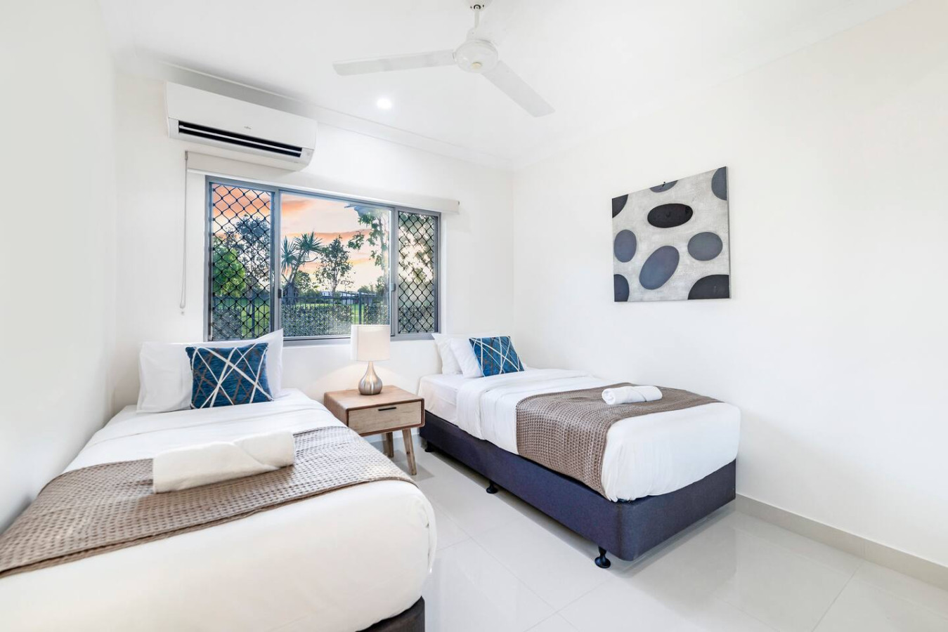 Zenhouse Stylish 3BR - Relax and recharge in our inviting bedroom, furnished with twin beds that offer the perfect combination of comfort and convenience."