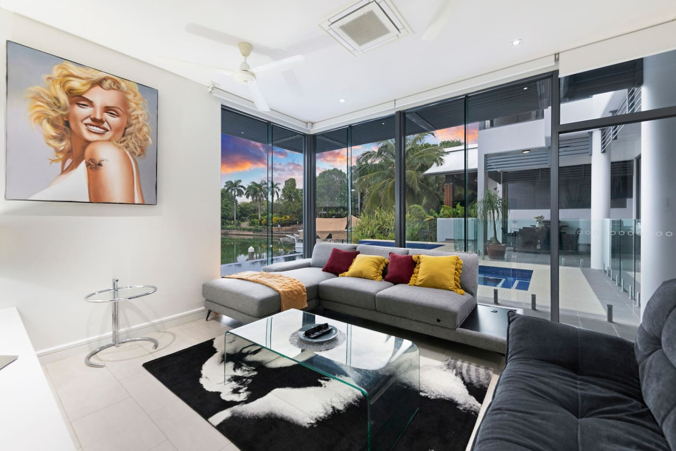 ZenLux: Waterfront Mansion Infinity Pool + Cinema- Experience the ultimate in luxury living – our living room offers breathtaking views of the infinity pool, where serenity meets sophistication
