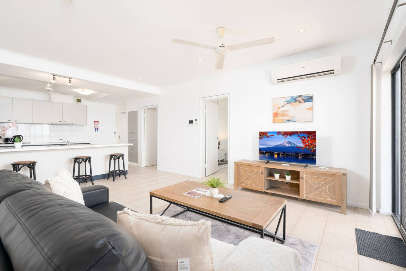 Oceanfront Gem: Pool ~ Balcony ~ Breathtaking View - Enjoy cozy evenings in our comfortable living room, featuring plush seating and a warm, welcoming atmosphere