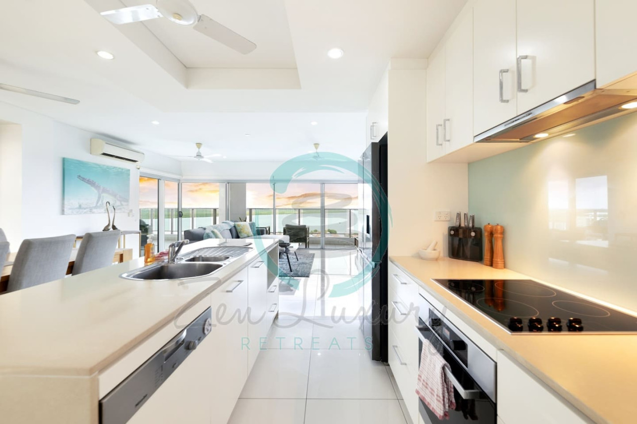 Zen By The Water: Compact but charming - whip up your favorite meals in our cozy kitchenette!
