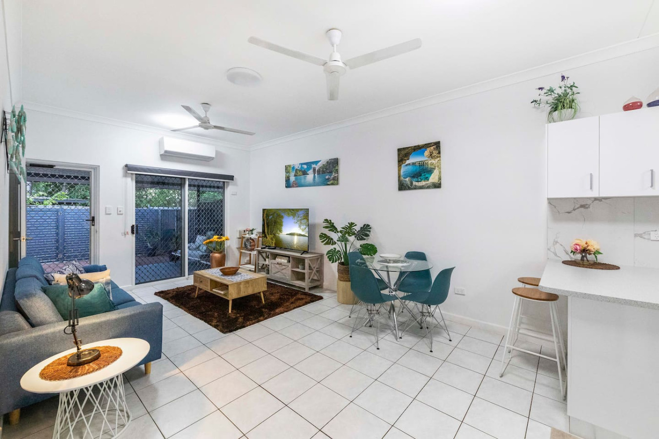 Zen Garden: Modern City Living ~ Outdoor Dining ~ Private Backyard - Cozy living room featuring a large sofa and entertainment center.