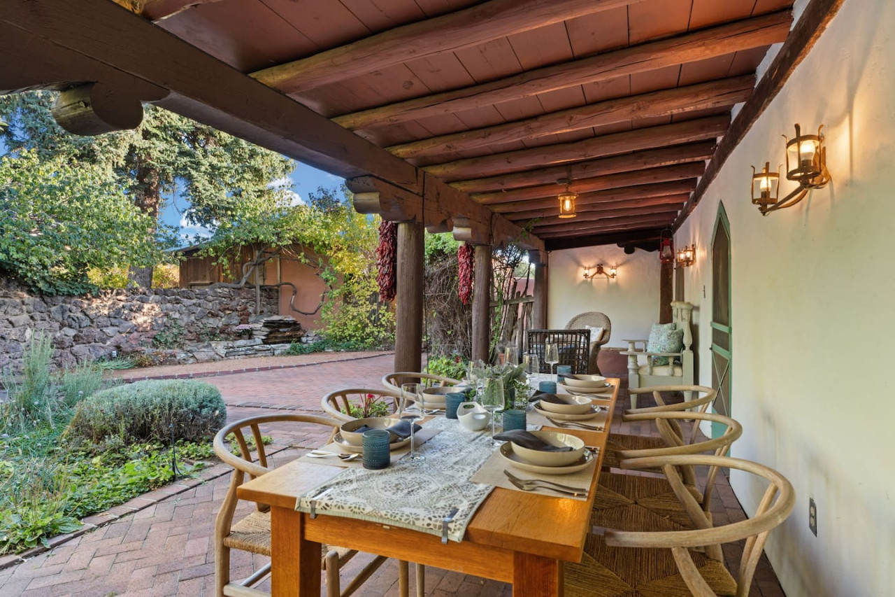 The shaded portal and outdoor dining area at the main house