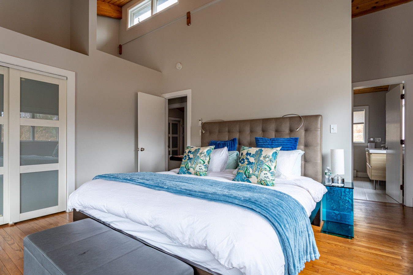 A bright, inviting bedroom featuring a cozy bed designed for the best nights sleep