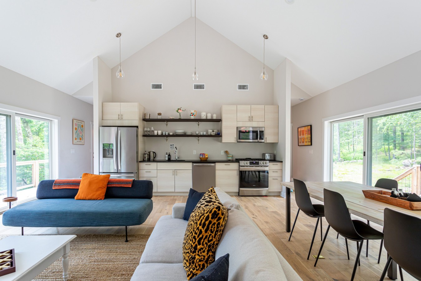 Floor-to-ceiling natural light brings the outdoors into this space