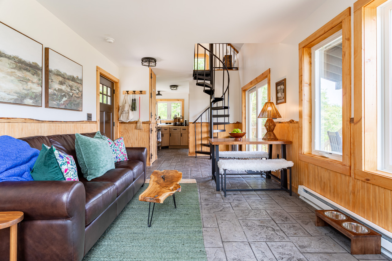 Beautiful and bright main level with spiral staircase leading to loft