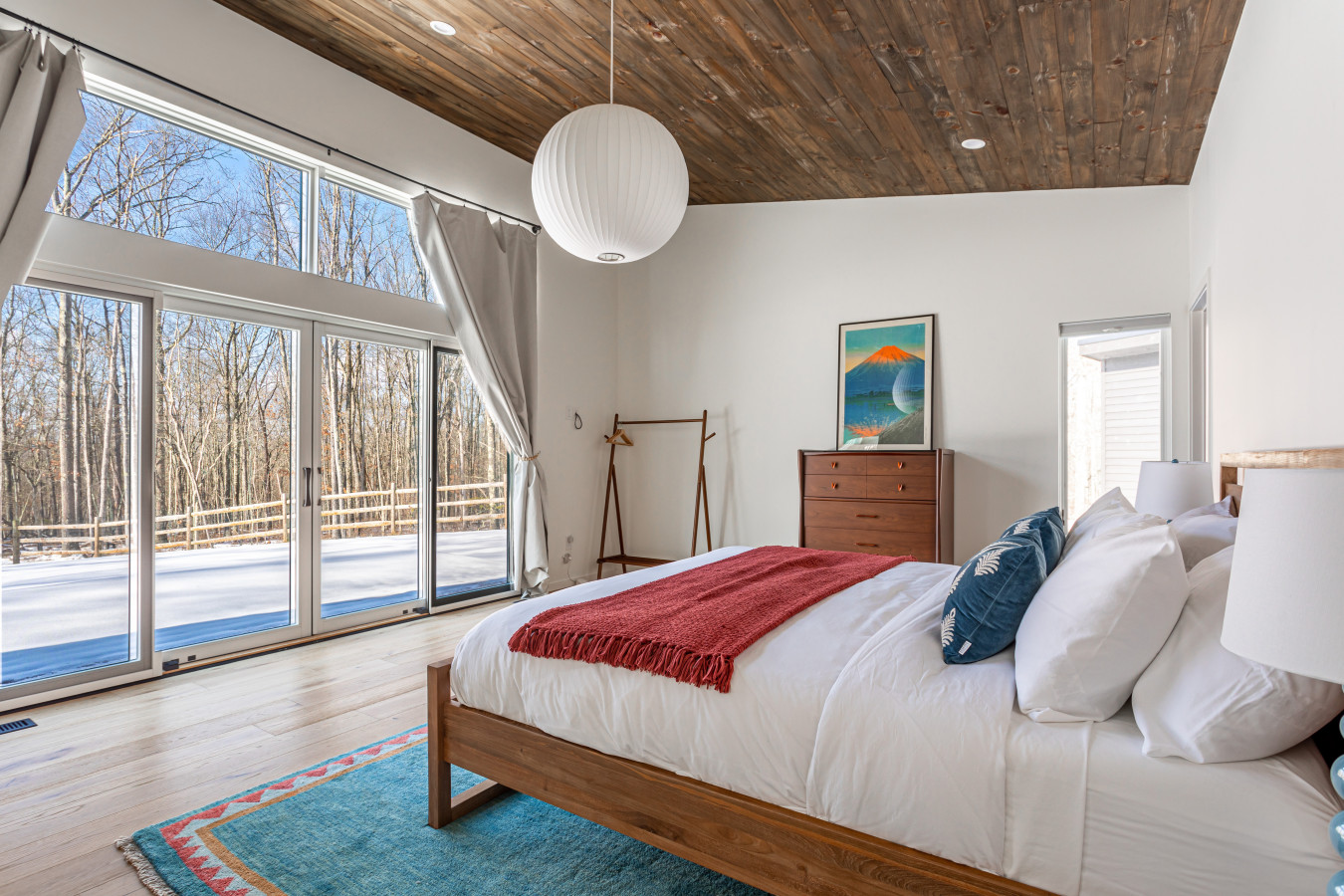 Wake up to gorgeous outdoor views in the principal bedroom, with direct access to the back deck for peaceful mornings and fresh air