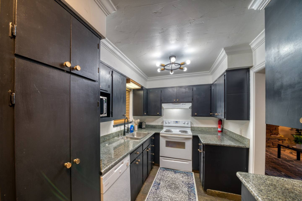 Fully stocked kitchen with all appliances.