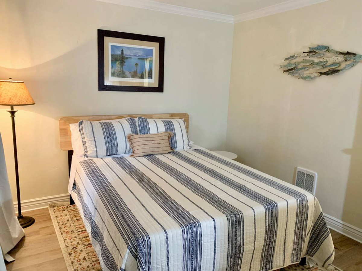 Relaxing bedroom with workspace area.