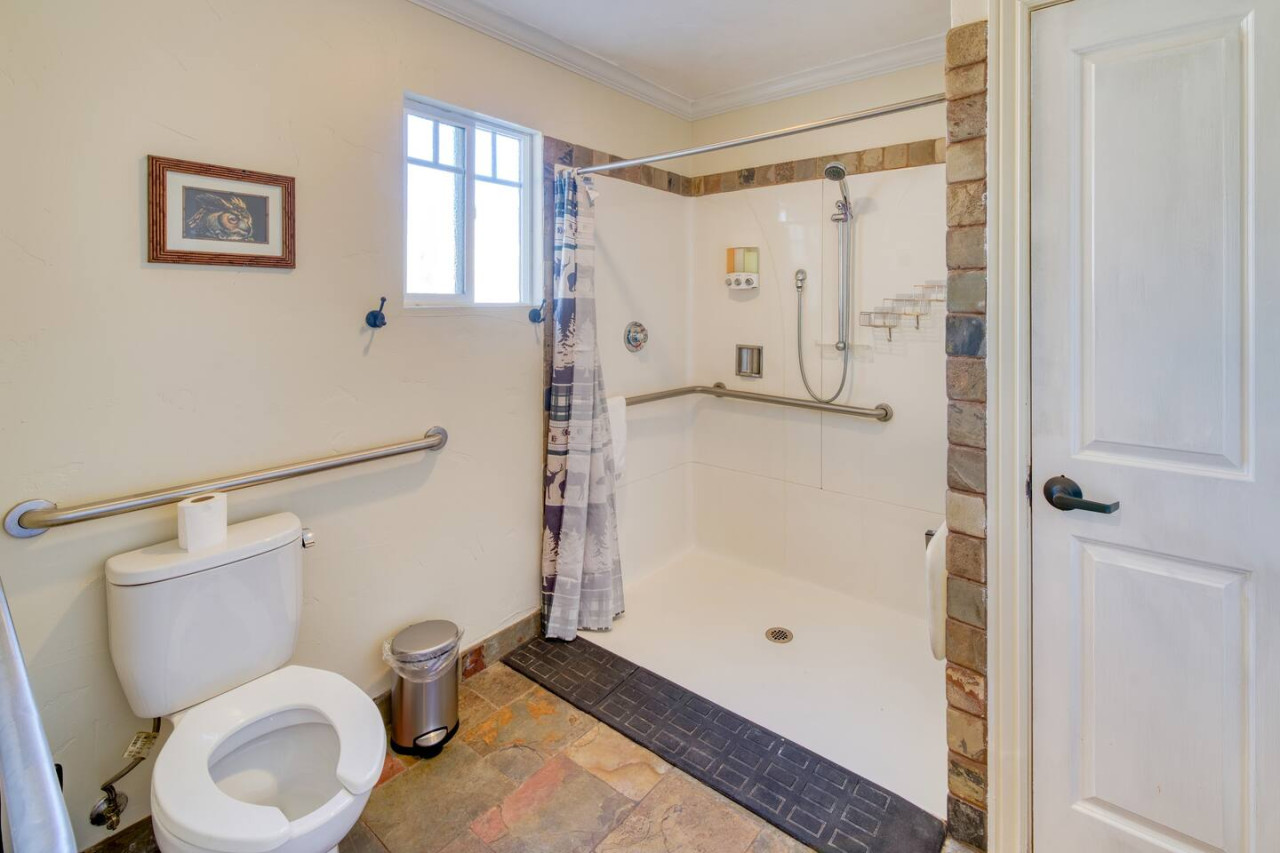 Full bathroom with large ADA compliant shower. Fully stocked with body wash, conditioner, and shampoo.