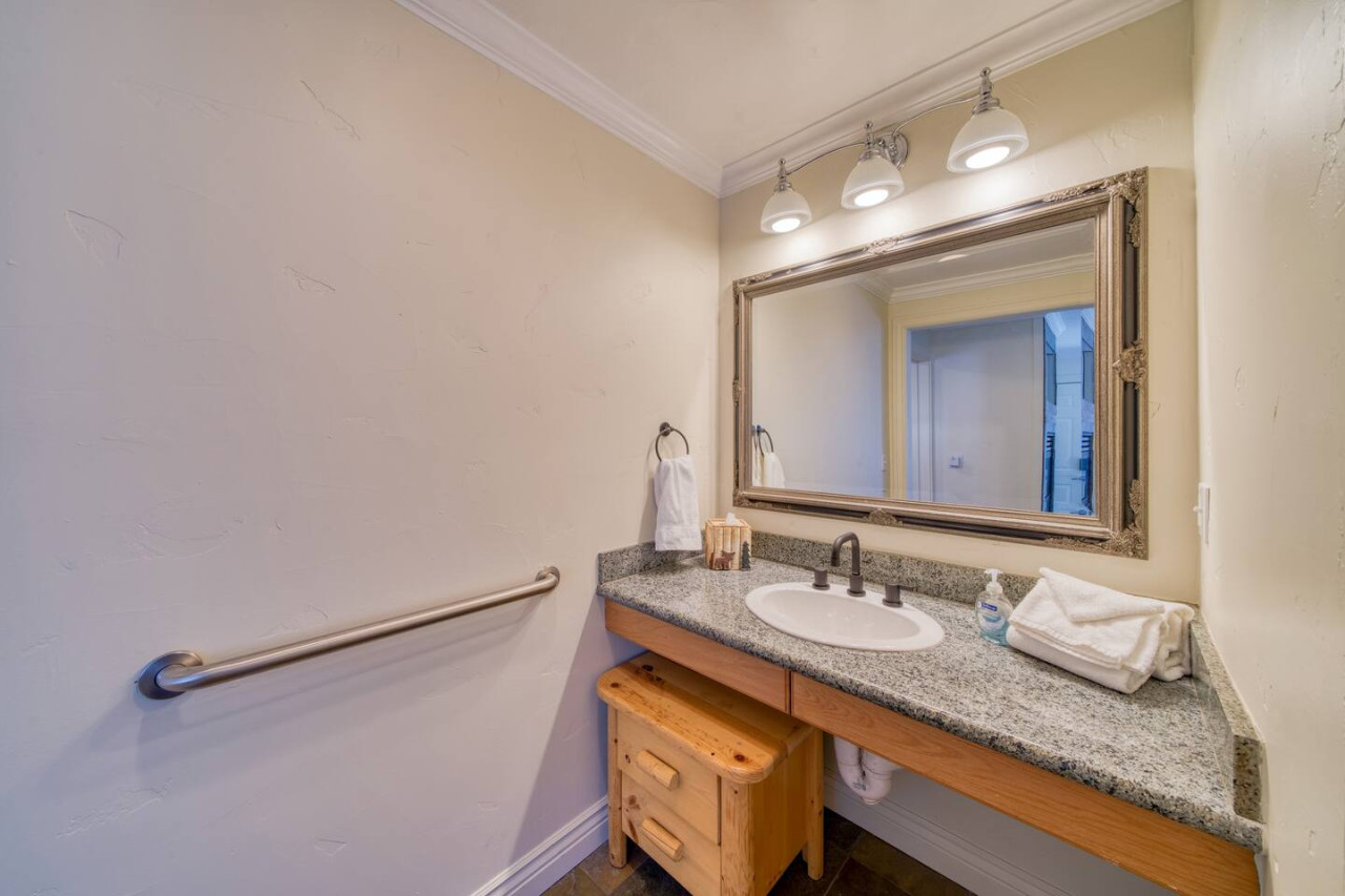 Large sink/vanity area, separate from the bathroom itself. View from the bedroom.