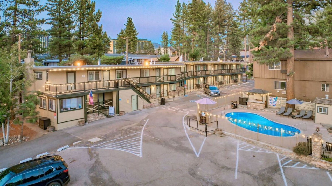 Property Building with parking space and pool view