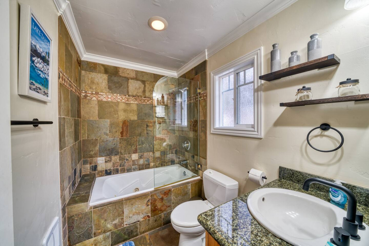 Bathroom with bathtub, toilet and sink
