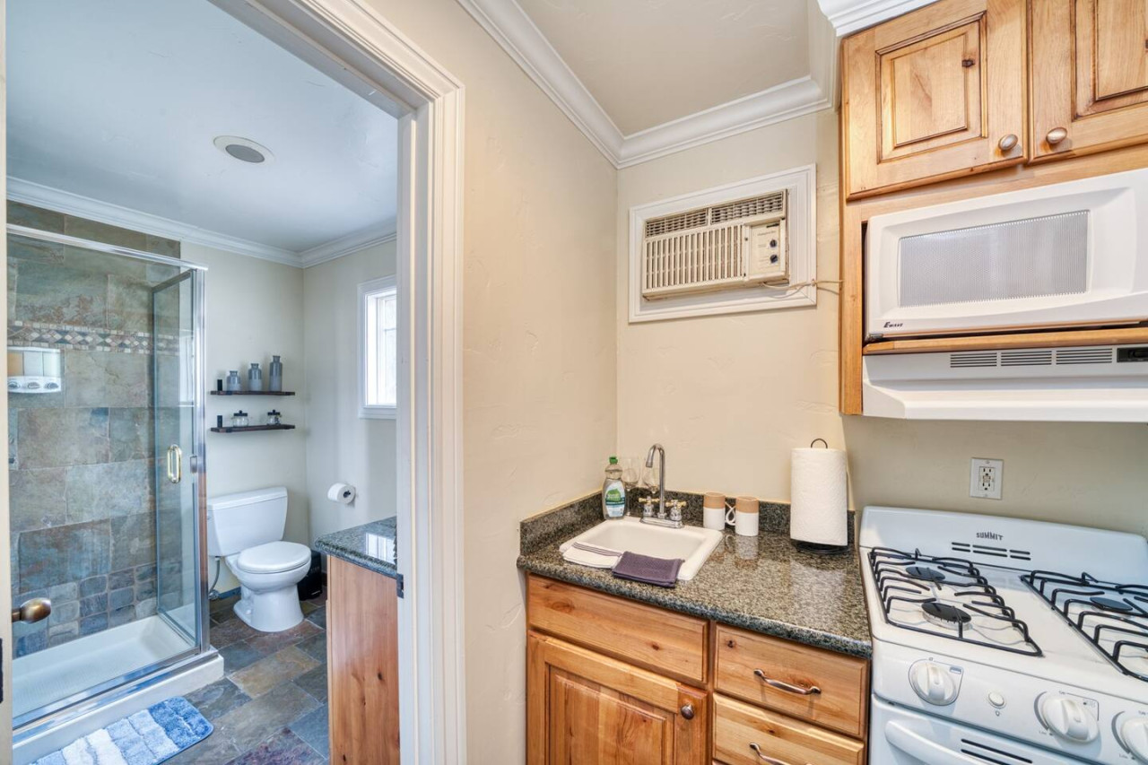 Kitchen beside bathroom