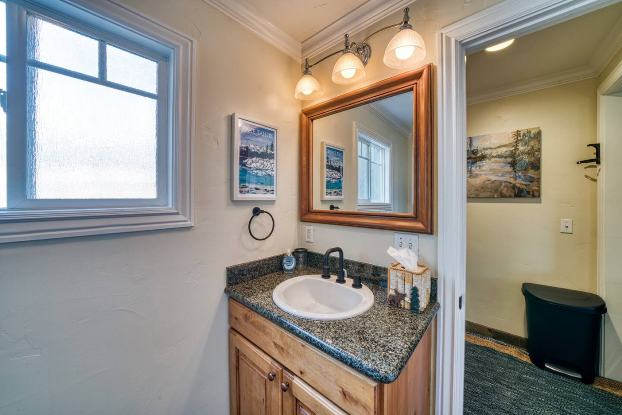 Bathroom with sink and vanity mirror