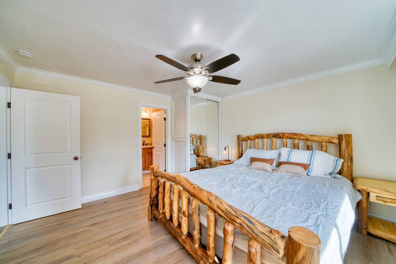 Master bedroom equipped with queen size bed and gas fire place, along with the attached master bathroom.