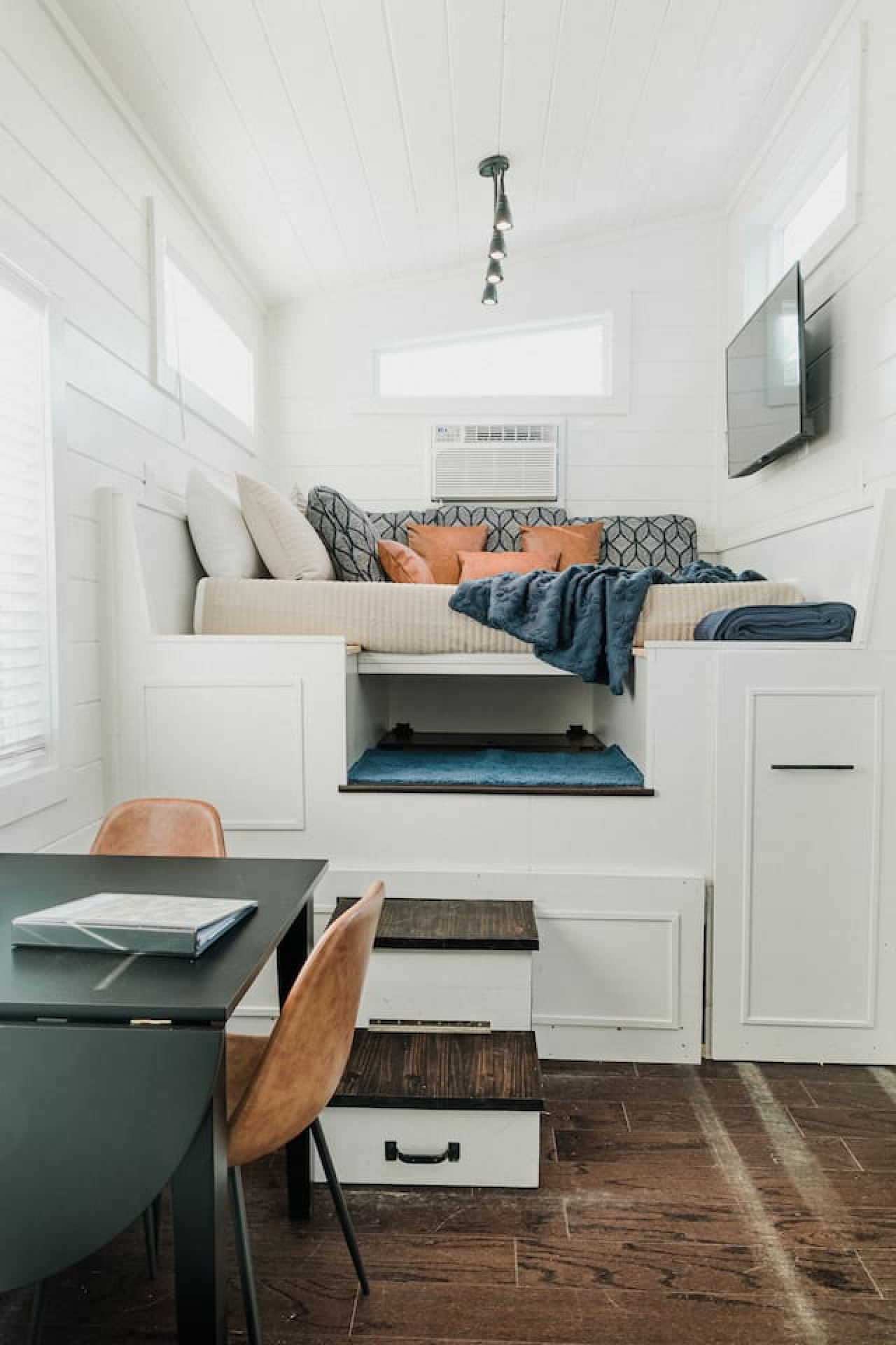 The steps can disappear under the bed storage area for more floor space.