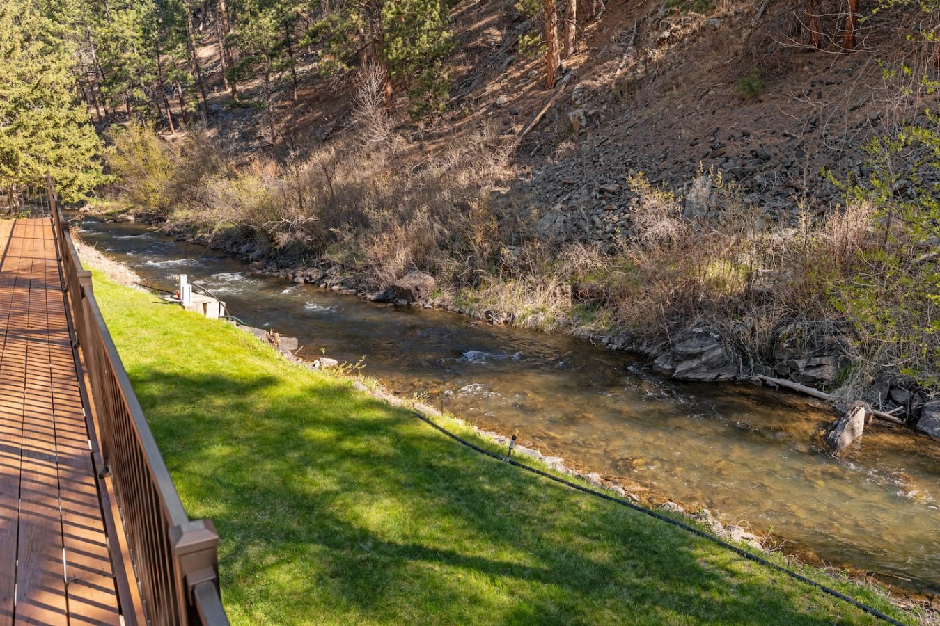 Creekside Retreat | Fireplace + Gameroom — photo 35