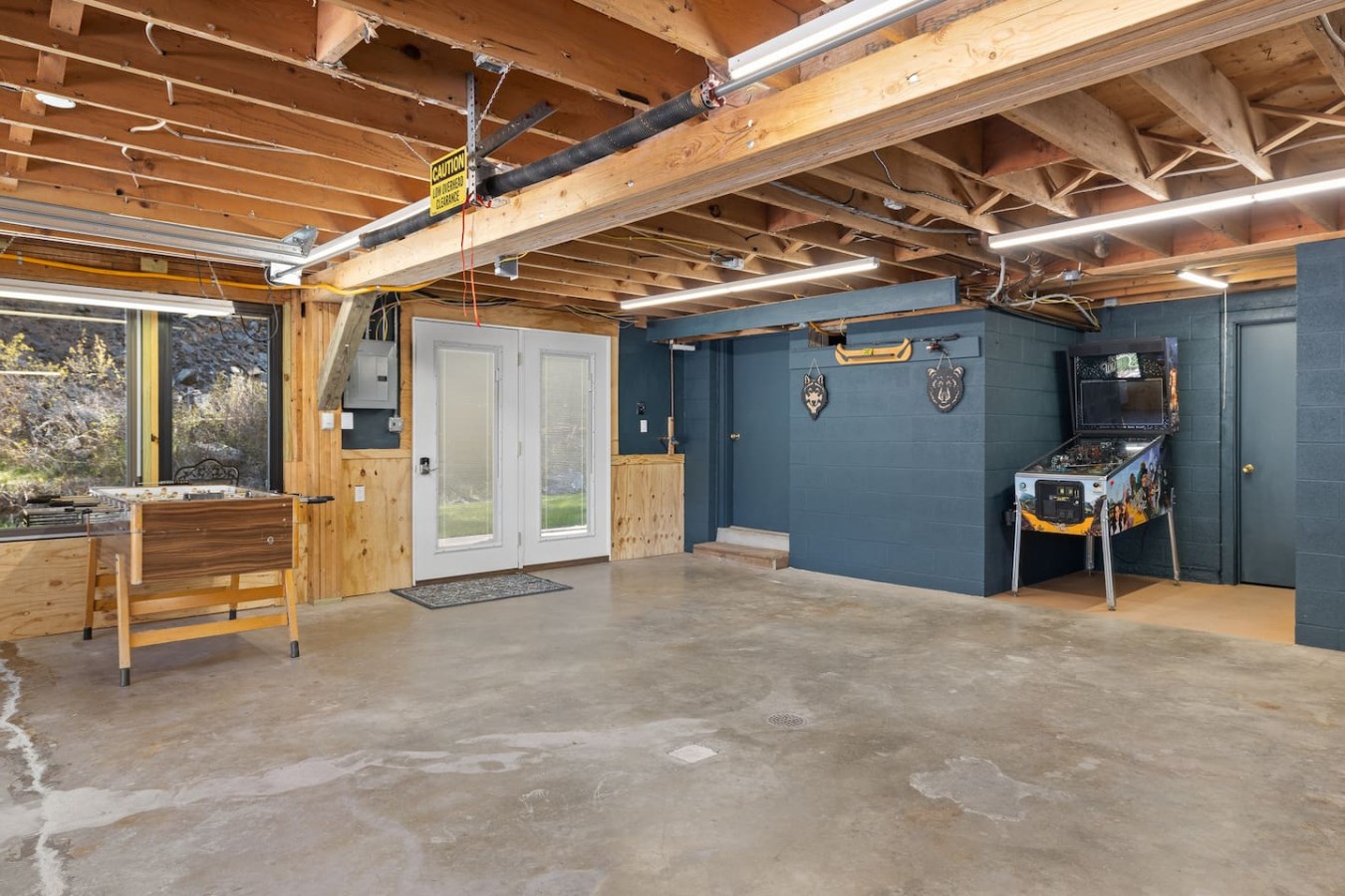 Creekside Retreat | Fireplace + Gameroom — photo 16