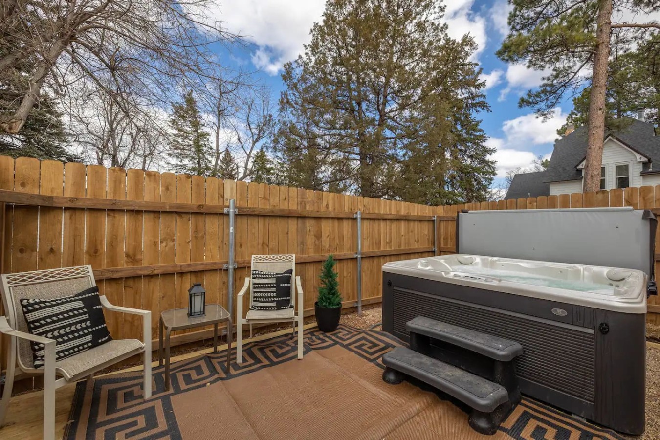 Our community hot tub is surrounded by a 6 foot privacy fence and is located right in the middle of all of our cabins.