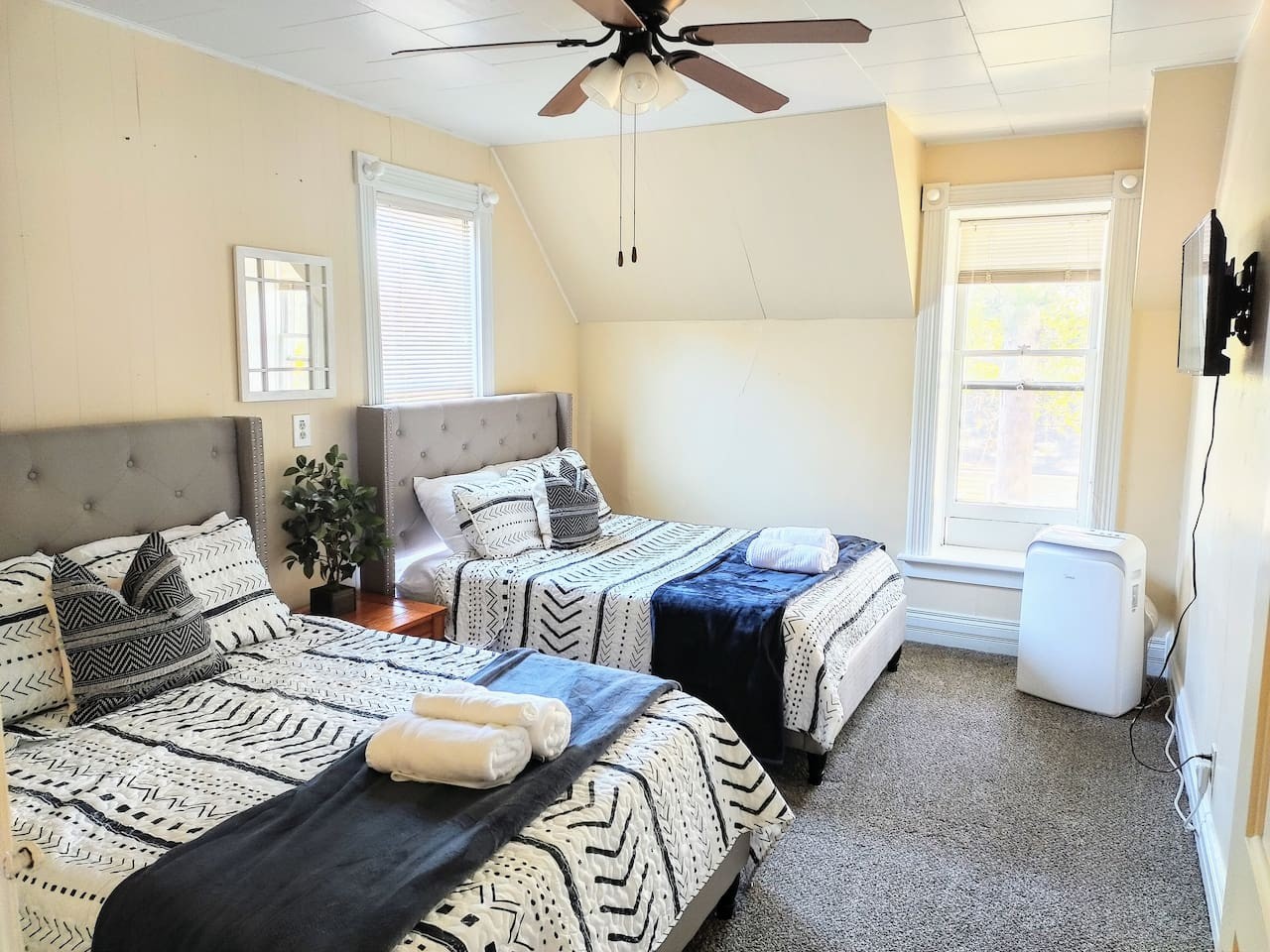 The second bedroom has two full size beds, a tv, and a walk in closet.