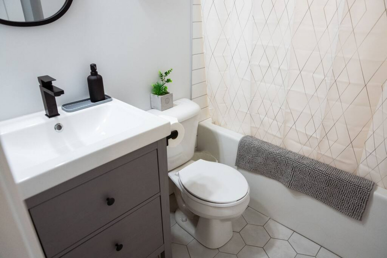 You feel a sense of calm as you enter the bathroom, where the thoughtful design and high-quality materials create a serene environment.