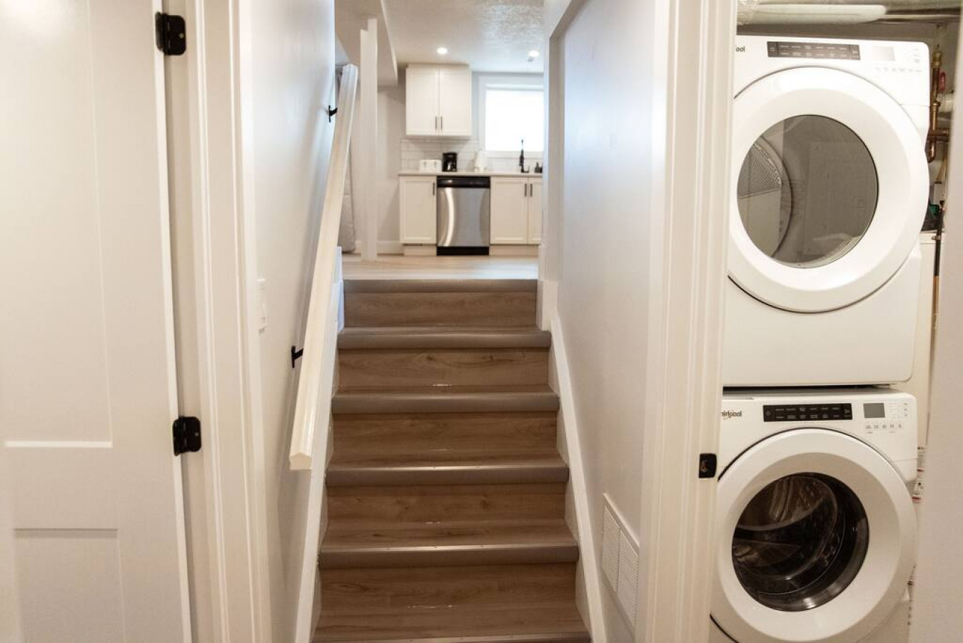 The staircase is a focal point of the home, with its graceful lines and stylish details adding to the overall charm.