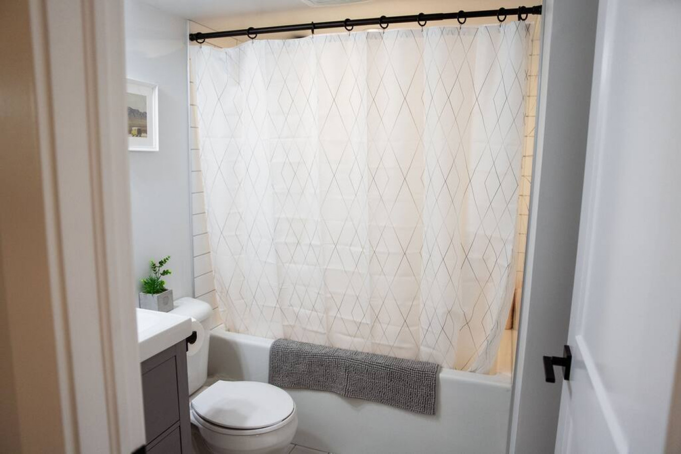 You feel a sense of calm as you enter the bathroom, where the thoughtful design and high-quality materials create a serene environment.