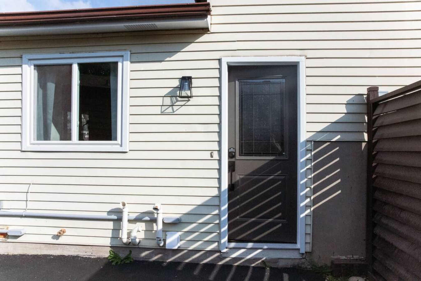 As you approach the house, the inviting entrance and beautiful exterior make you eager to explore what’s inside.