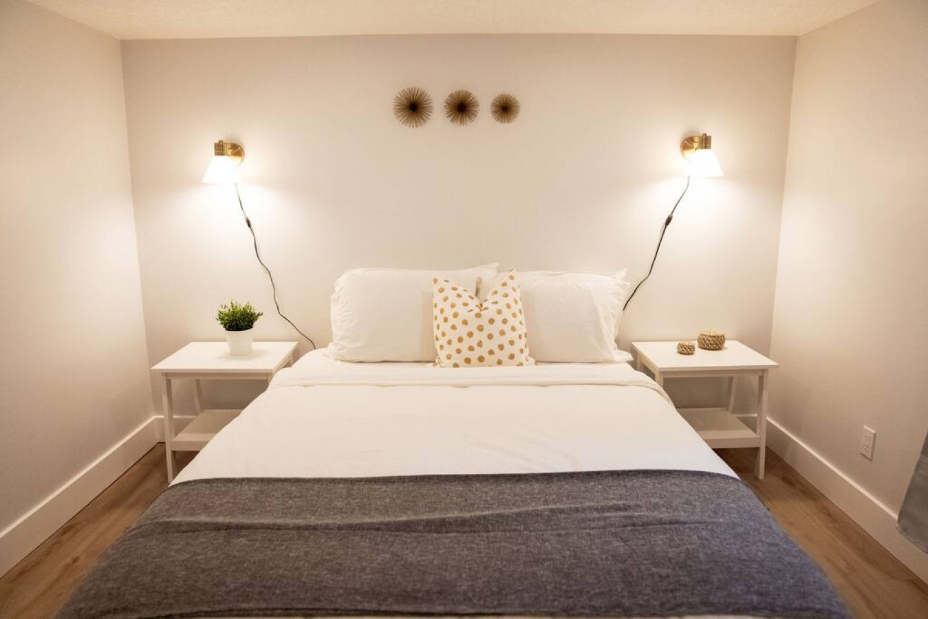 You feel enveloped in comfort as you relax on the queen bed, surrounded by a room designed for tranquility.