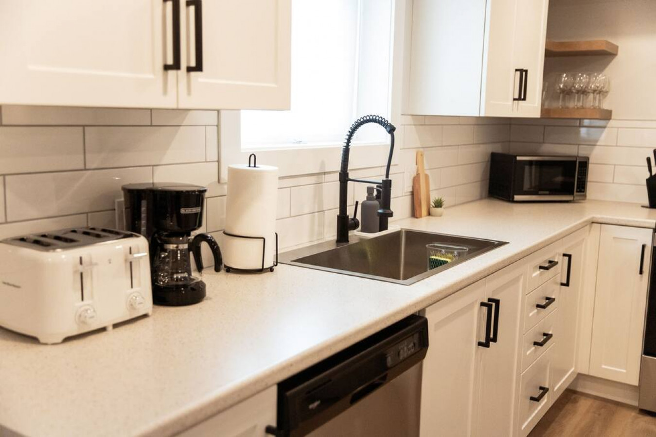 As you open the kitchen, you discover an assortment of coffee pods, and sugar, ensuring you have everything you need for a perfect morning or afternoon pick-me-up.