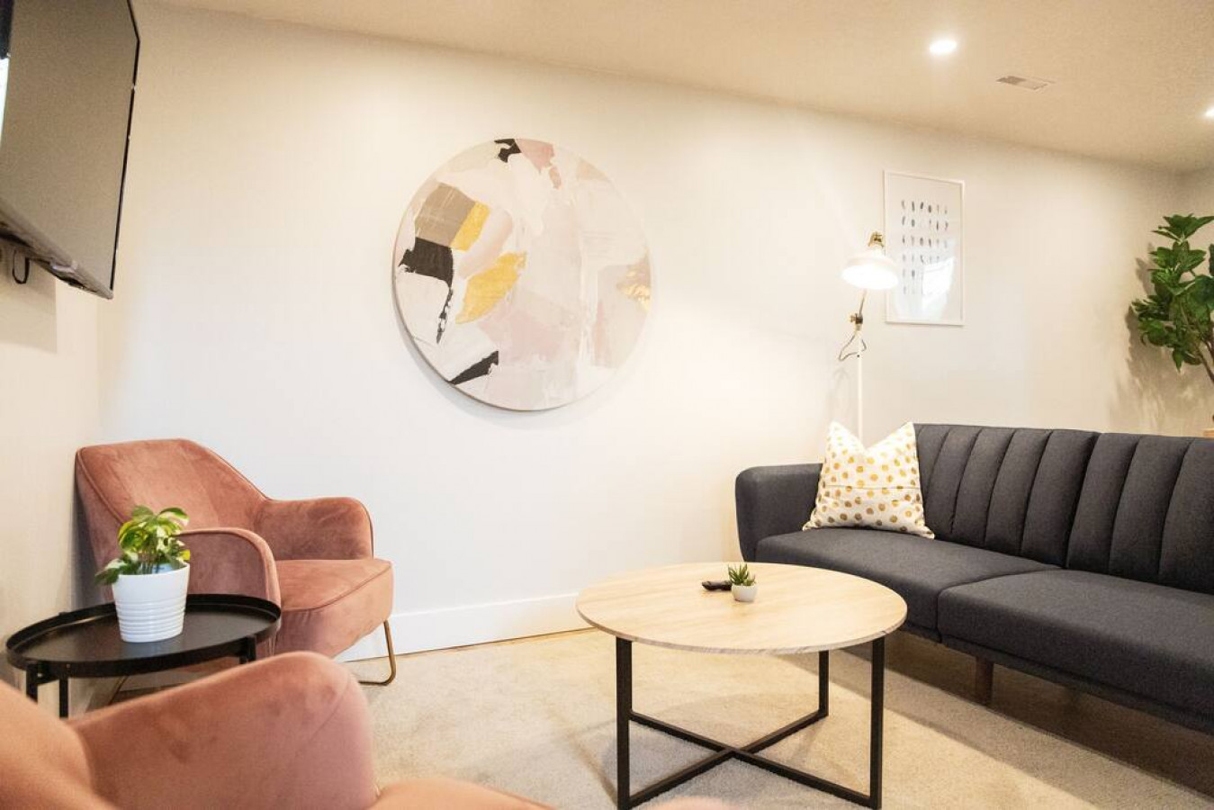 The living room’s cozy vibe makes it the perfect spot to relax, with ample seating and a warm ambiance.