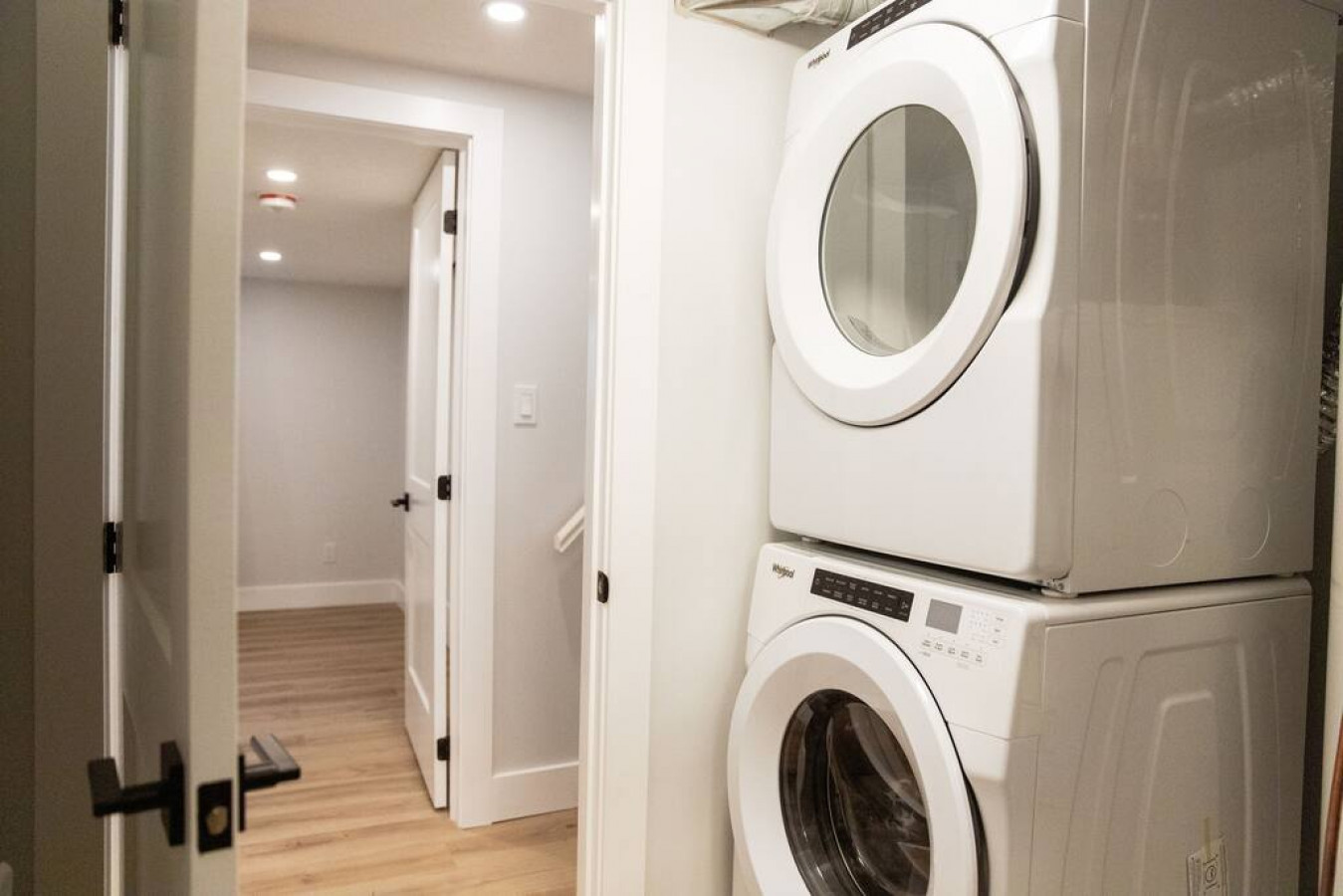 As you step into the laundry room, the modern appliances and ample storage space make it easy to keep things tidy.