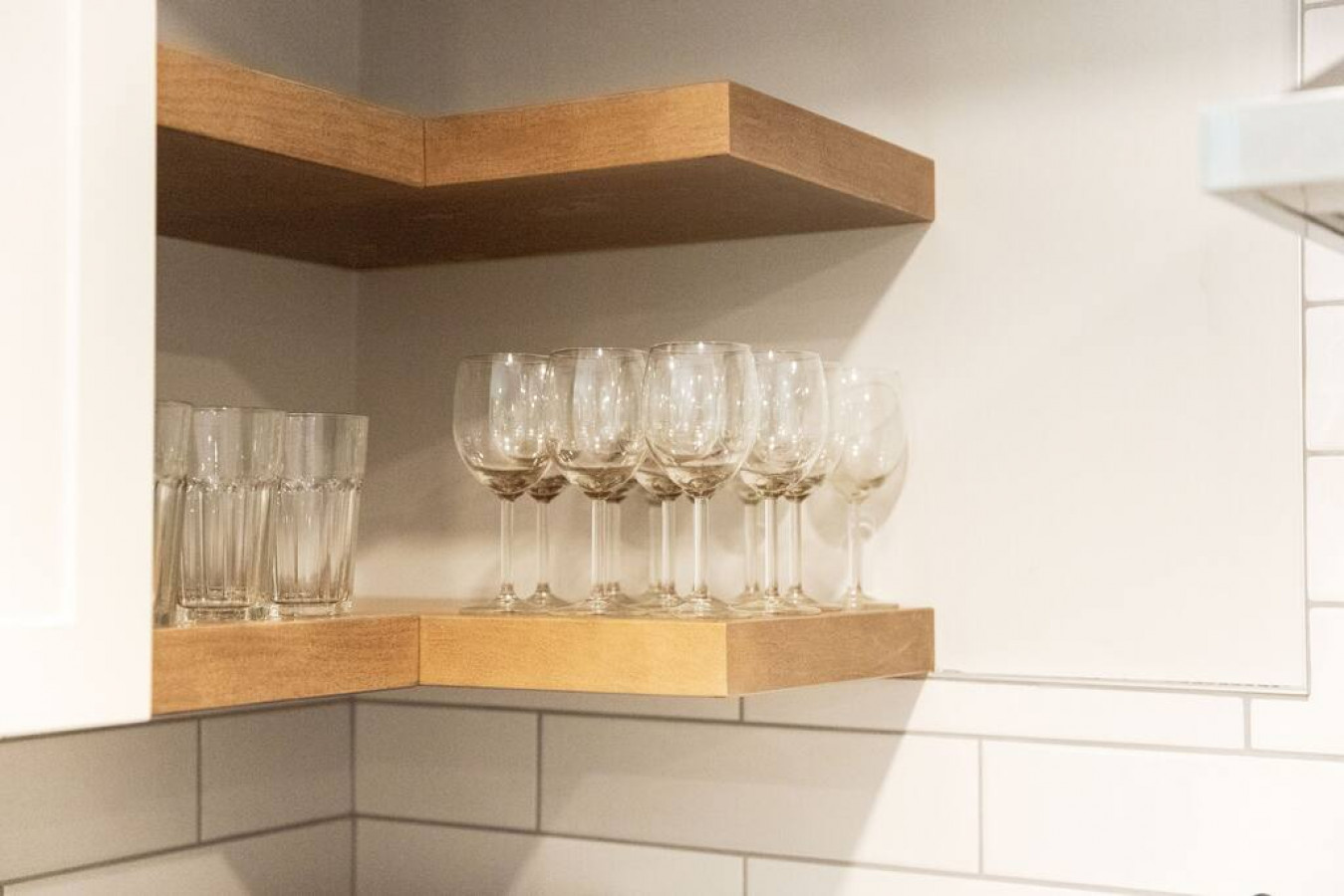 Kitchen cabinets stocked with cooking wares, glassware and silverwares, ideal for mixing up your favorite meals and drinks during your stay.