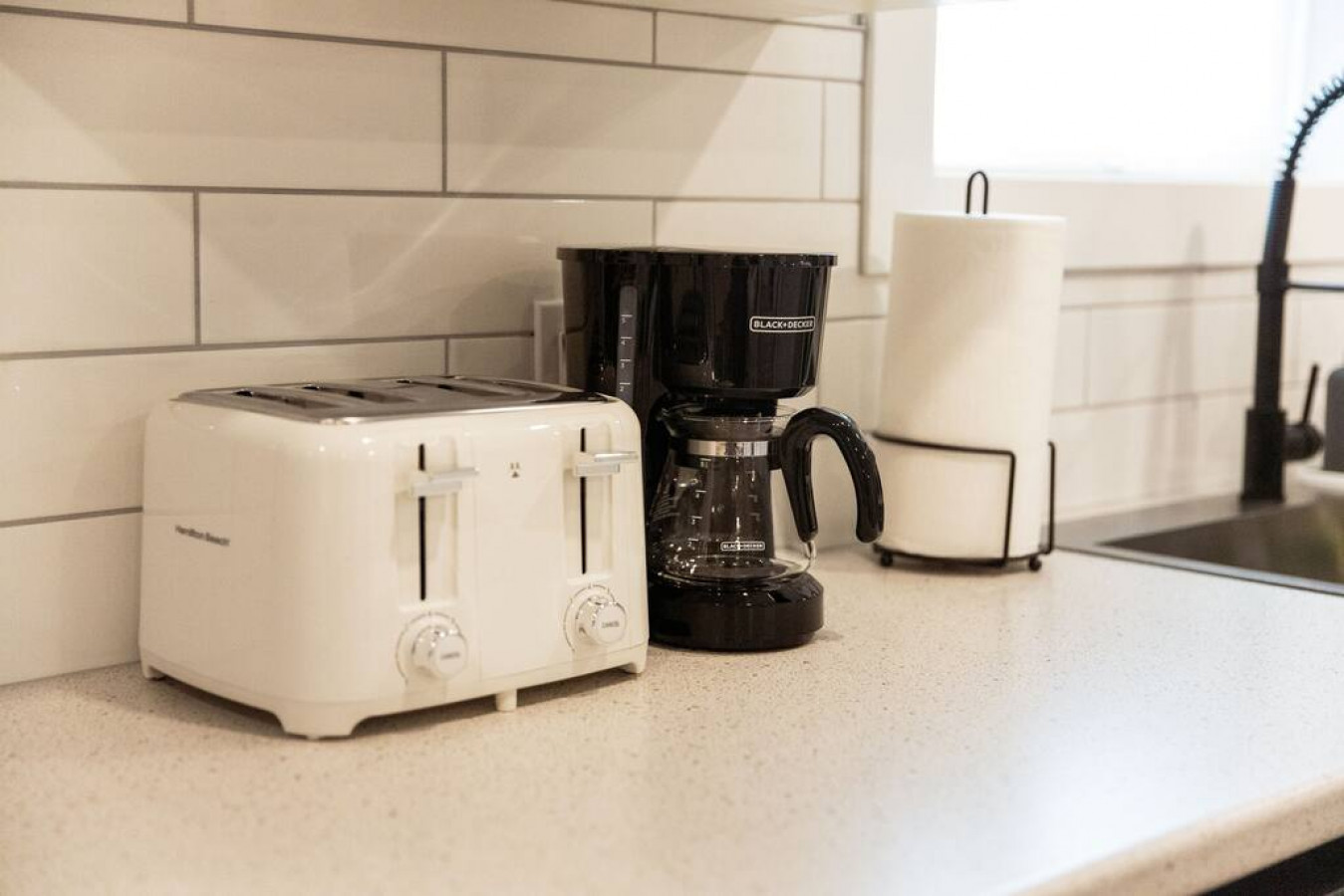 The coffee station is thoughtfully equipped with a variety of in-house consumables, including a selection of ground coffee, sweeteners, and creamers to suit every taste.