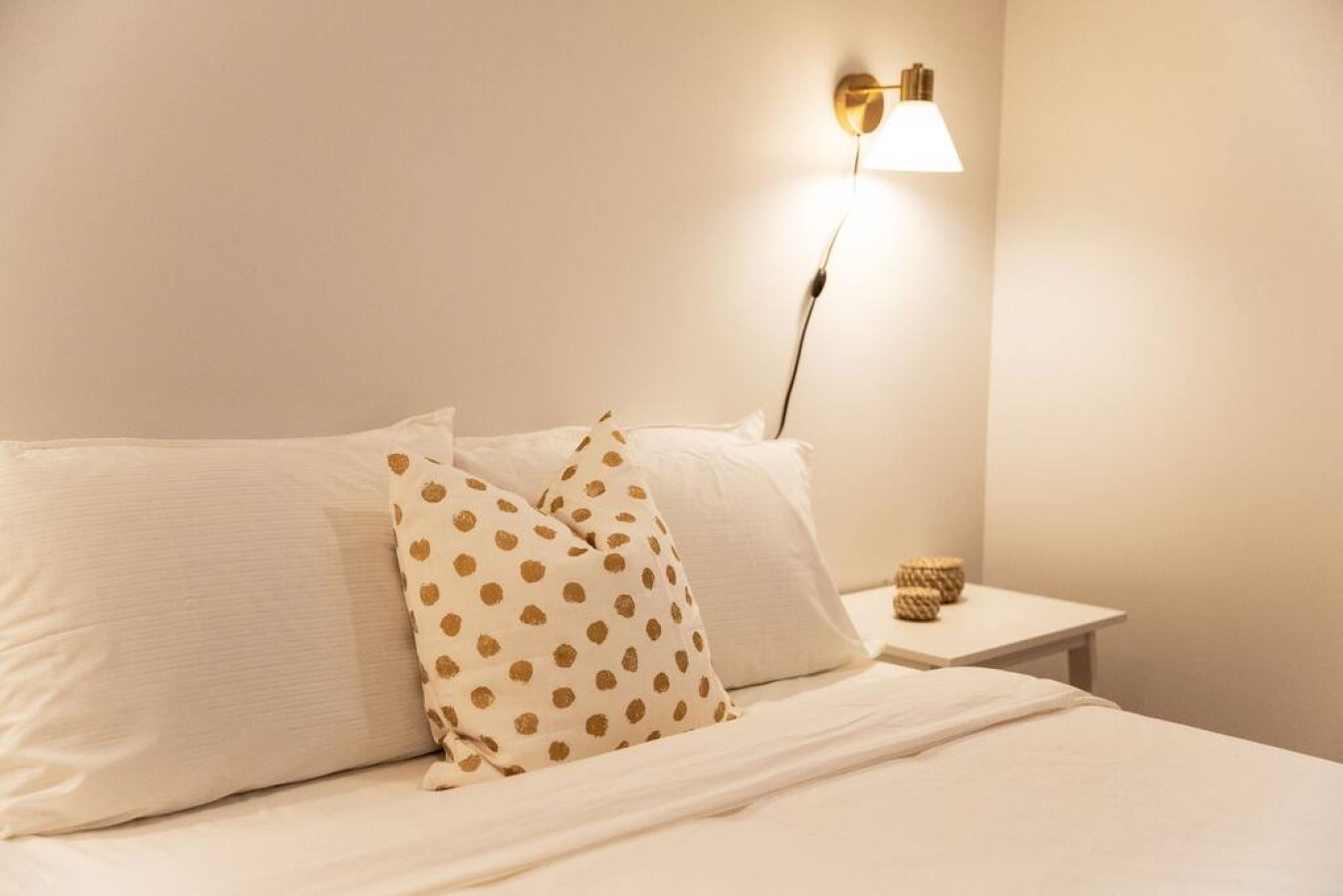 You feel enveloped in comfort as you relax on the queen bed, surrounded by a room designed for tranquility.