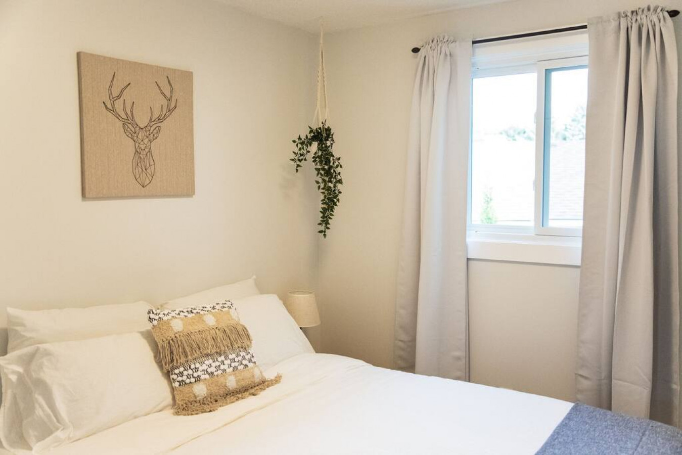 The bedroom’s serene ambiance invites you to relax, with a plush bed that promises a restful night's sleep.