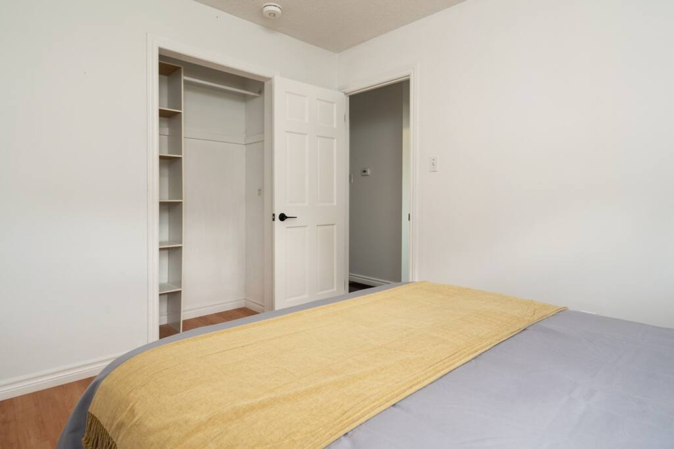 Luxurious bedroom featuring a comfortable bed, elegant decor, and plenty of natural light for a rejuvenating sleep.
