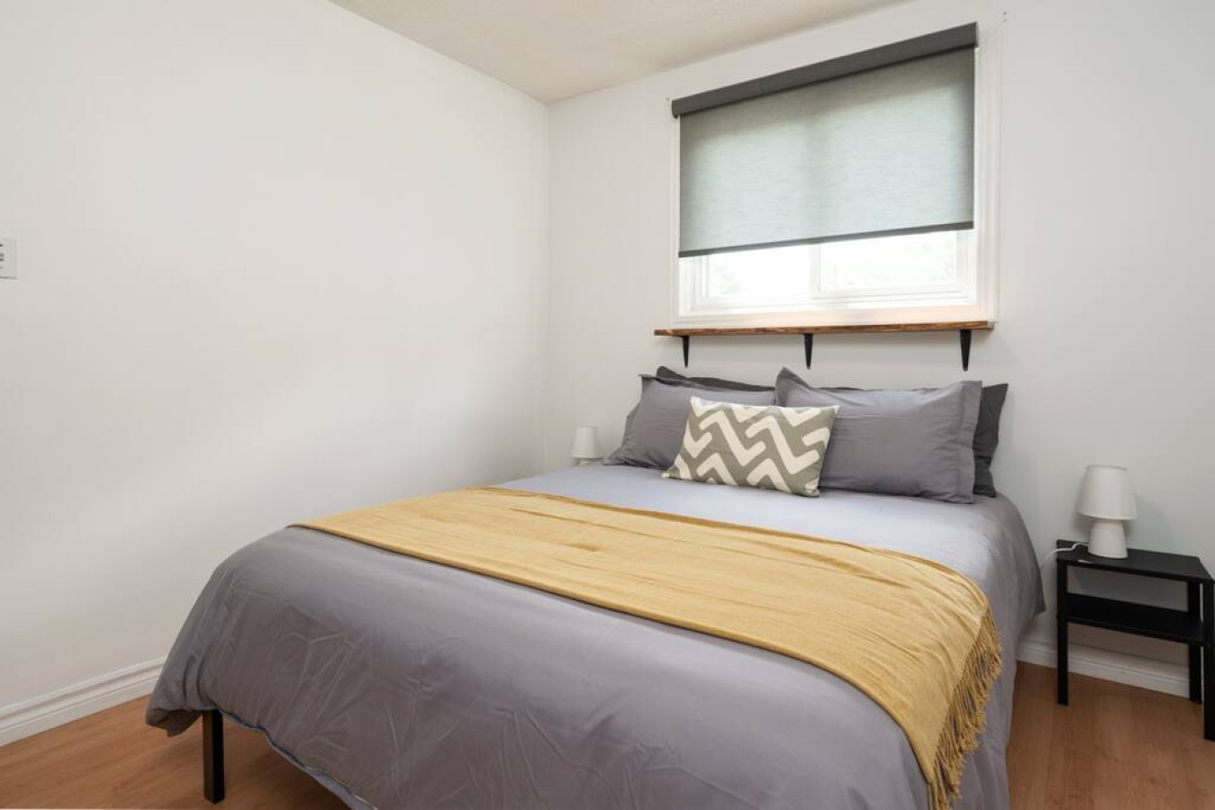 Cute spacious bedroom with queen bed that sleeps 2. Memory foam mattress with comfort in mindCozy bedroom with nightstands and blindsComfortable pillows with new sheetsDecorative pillows and throw