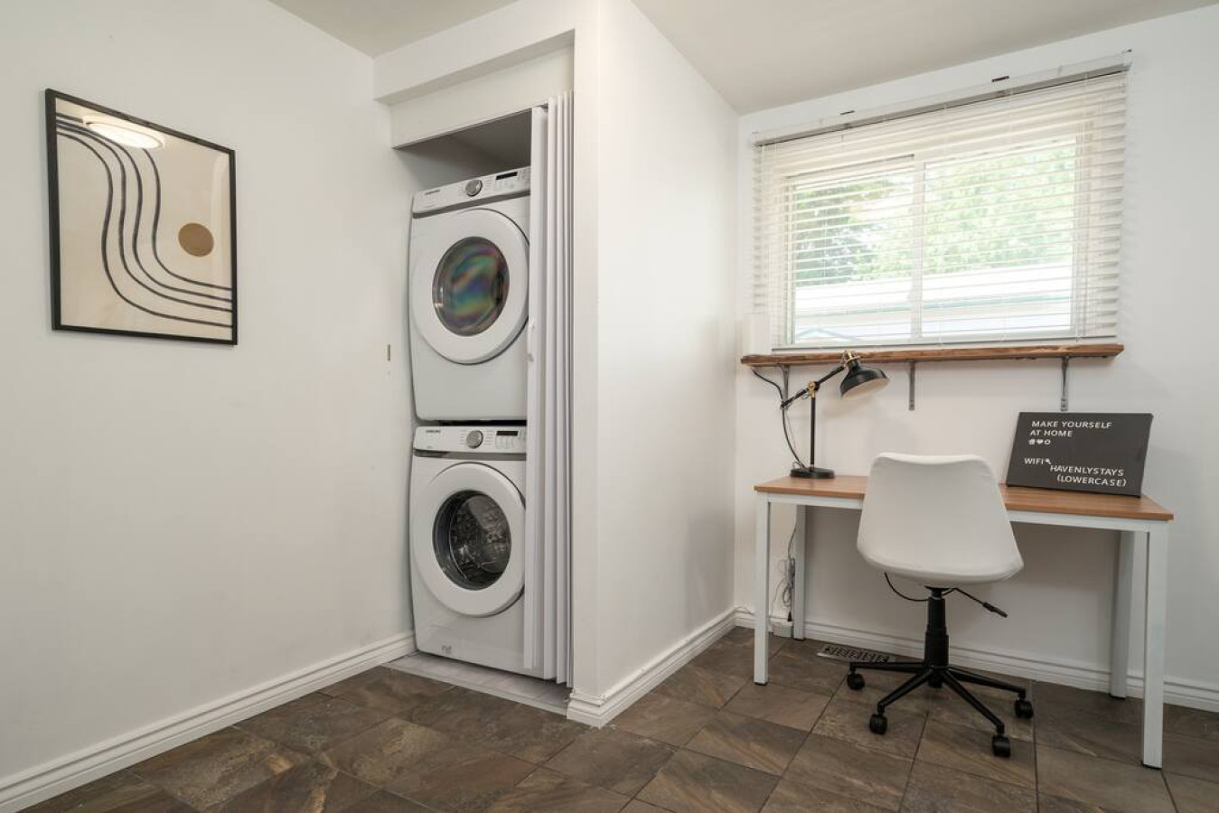 Convenient laundry room with washer, dryer, and all necessary supplies, making it easy to take care of your laundry needs.