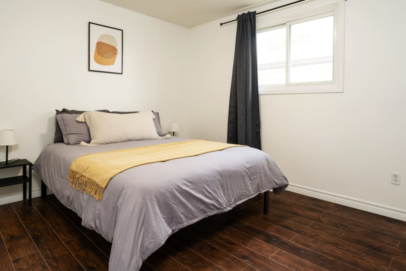 The bedroom’s serene ambiance invites you to relax, with a plush bed that promises a restful night's sleep.