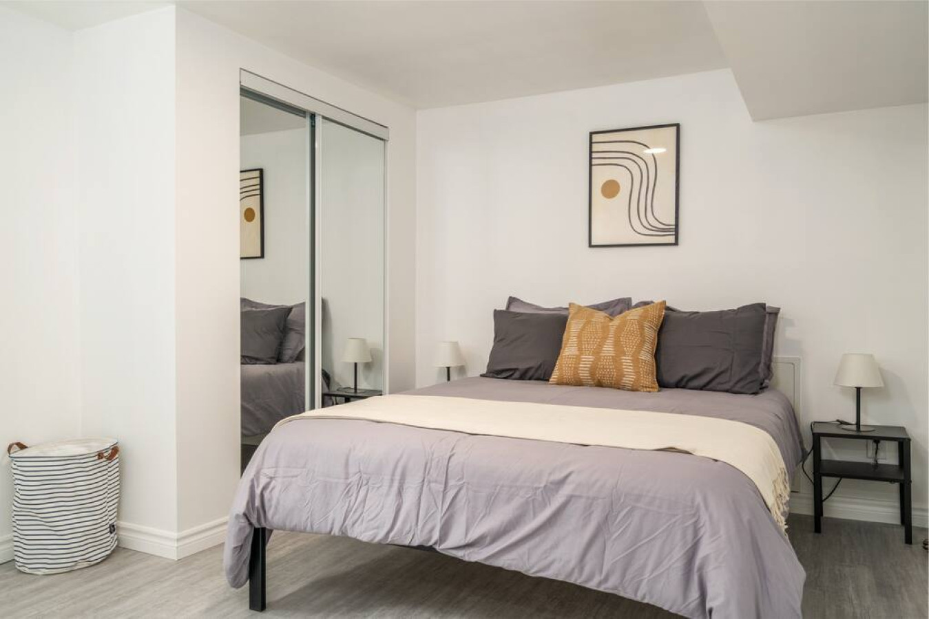 The bedroom’s serene ambiance invites you to relax, with a plush bed that promises a restful night's sleep.