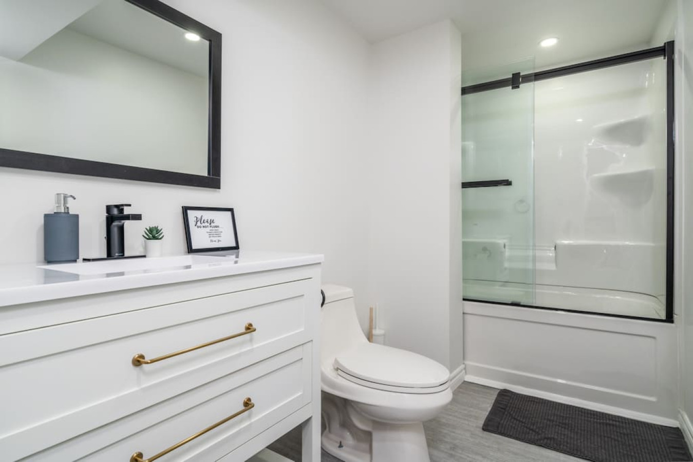 You feel a sense of calm as you enter the bathroom, where the thoughtful design and high-quality materials create a serene environment.