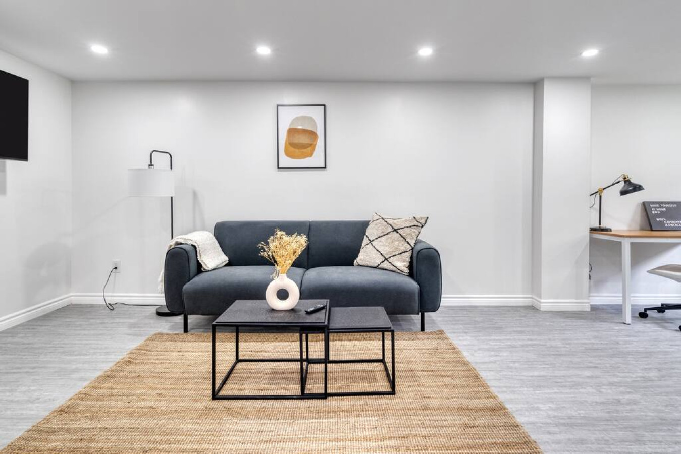 You feel at home as you settle into the living room, where the inviting atmosphere is perfect for lounging or entertaining.