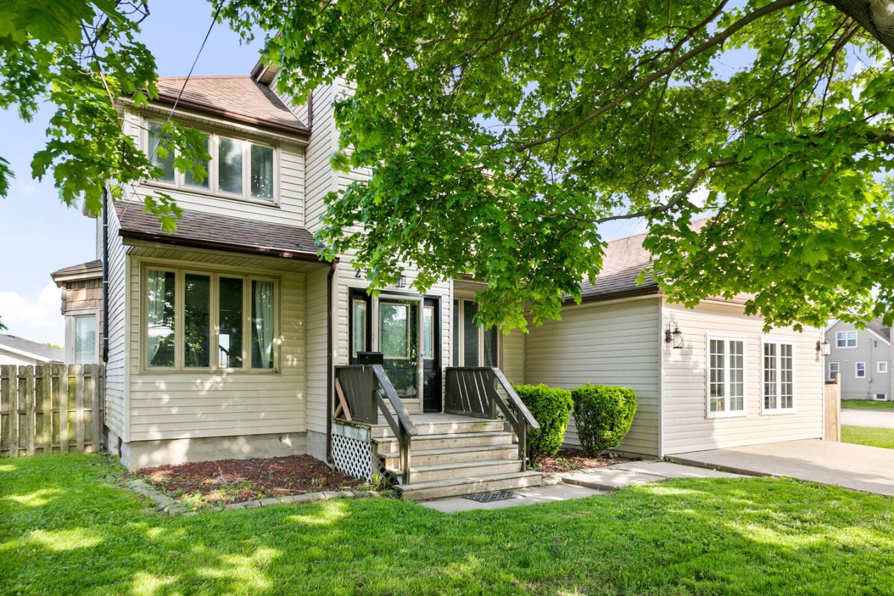As you approach the house, the inviting entrance and beautiful exterior make you eager to explore what’s inside.