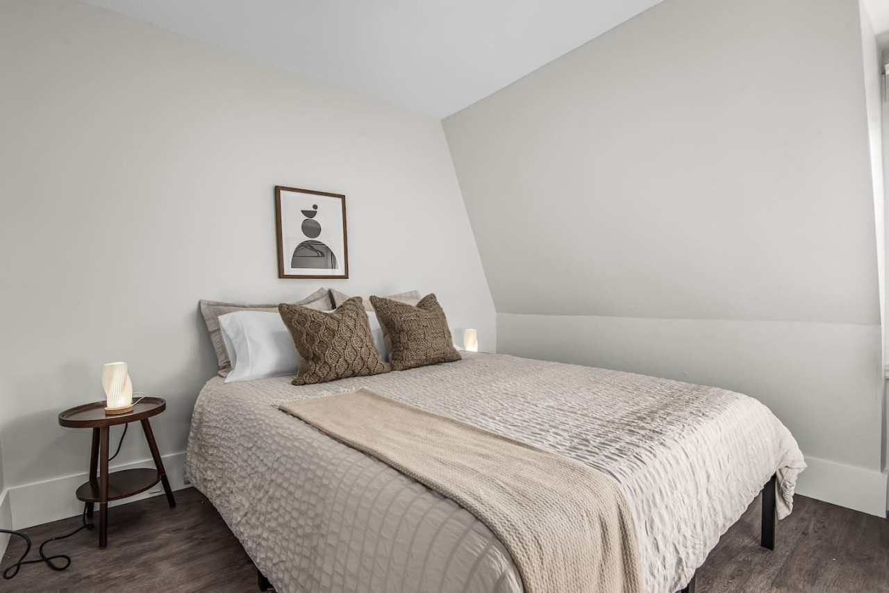 The bedroom’s serene ambiance invites you to relax, with a plush bed that promises a restful night's sleep.