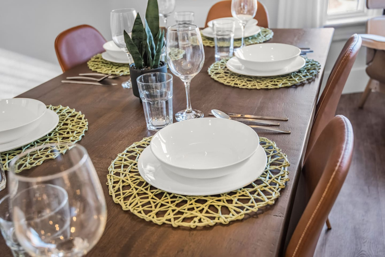 The dining room is bathed in natural light, creating a bright and inviting space where every meal feels special.