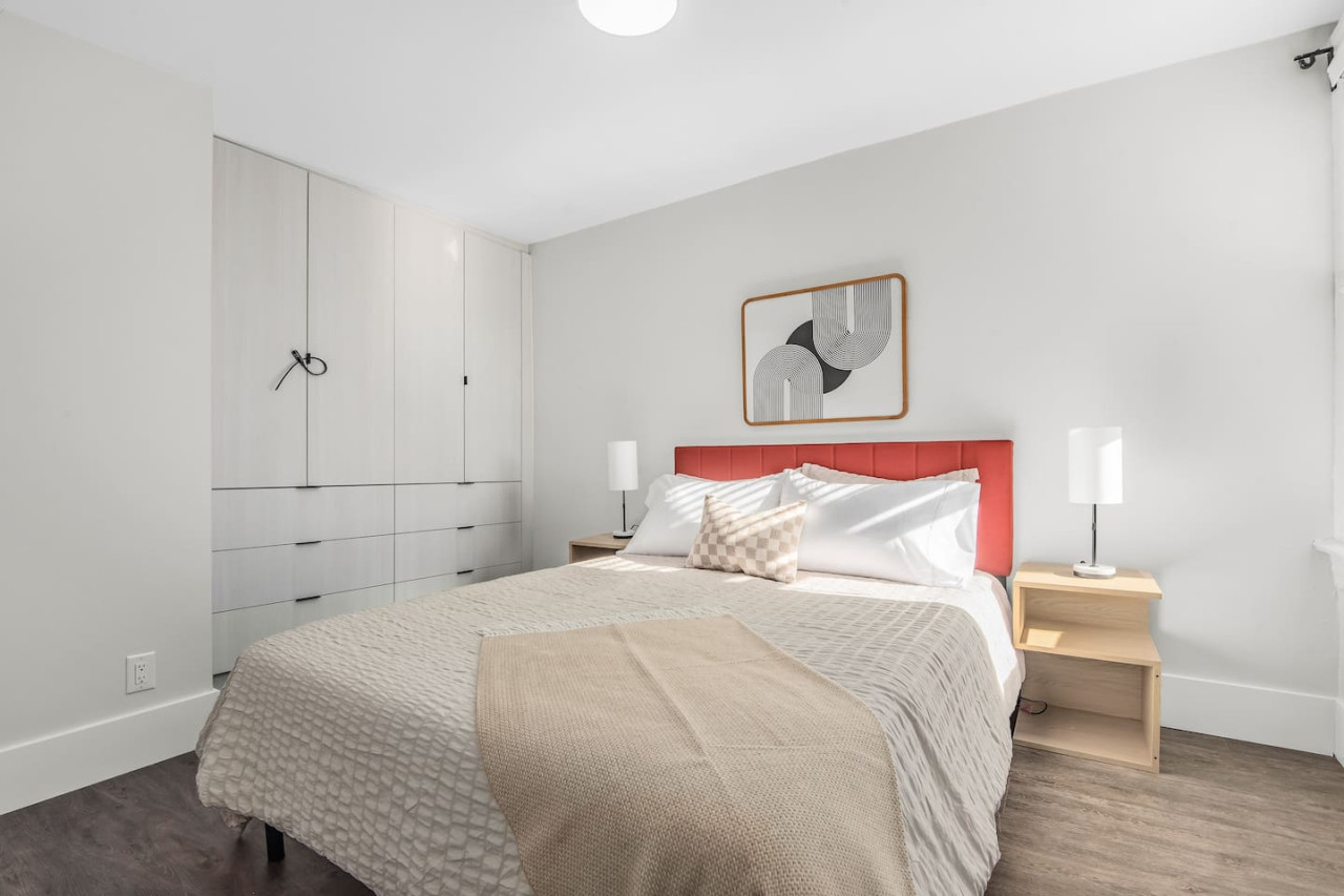 The bedroom’s serene ambiance invites you to relax, with a plush bed that promises a restful night's sleep.