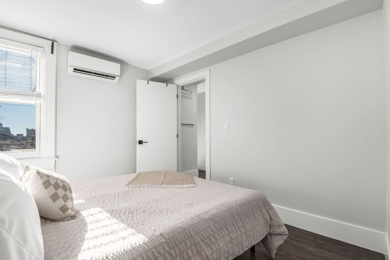 The bedroom’s serene ambiance invites you to relax, with a plush bed that promises a restful night's sleep.