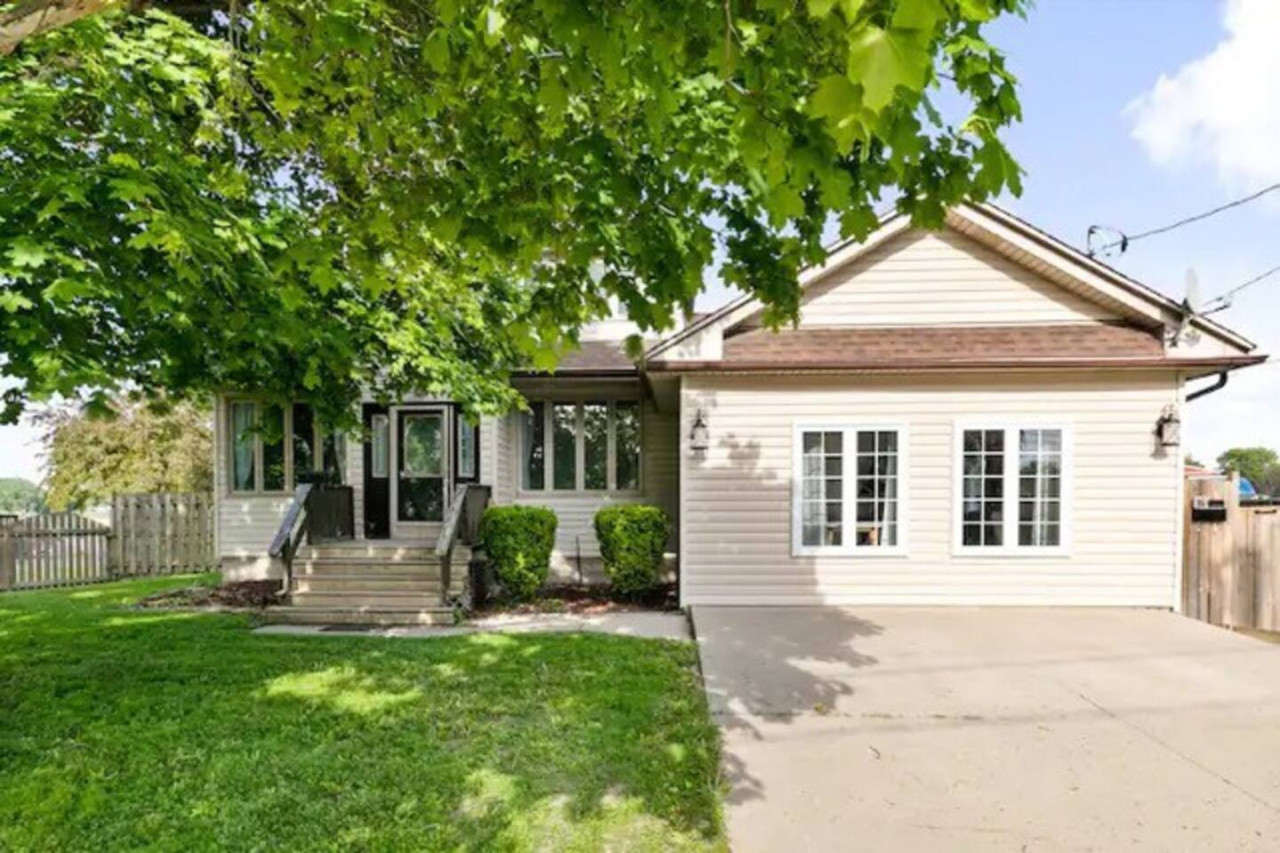 Welcoming facade of the home, showcasing beautiful architecture and a well-maintained exterior, perfect for a relaxing stay.