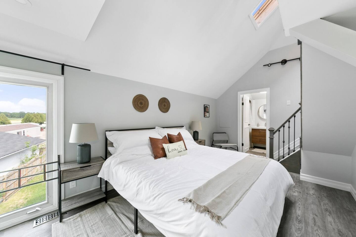 The bedroom offers a luxurious retreat, with a bed that promises restful nights and a room that feels like a private oasis.